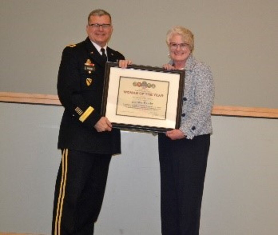 Army Brig. Gen. Mark Simerly, DLA Troop Support commander, left, presents Jennifer Hamby, right, Audit Readiness division, a plaque for her exemplary model of public service and government leadership during the Women’s History Month Program March 13. Hamby was selected Woman of the Year in the non-supervisory GS-11 and above category. (Photo by Alexandria Brimage-Gray)
