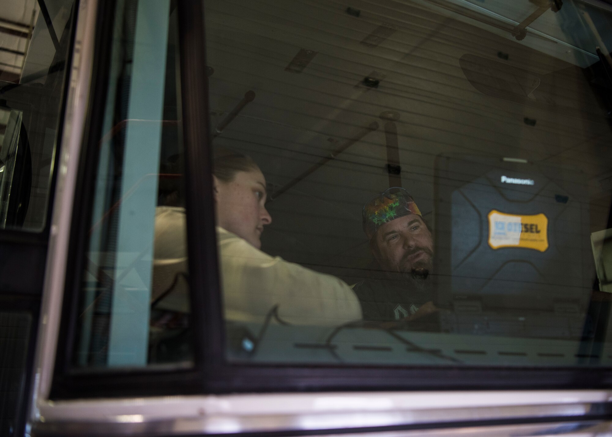 Image of Mr. Kent Kleffner, 366 Logistics Readiness Squadron automative service excellence master technician, trains Staff Sgt. Jory Fueston, 366 LRS vehicle management technician, on how to use their new vehicle diagnostic tool. This tool is capatable with a large variety of vehicles, enabling LRS to save resources by performing diagnostic maintenance in-house.