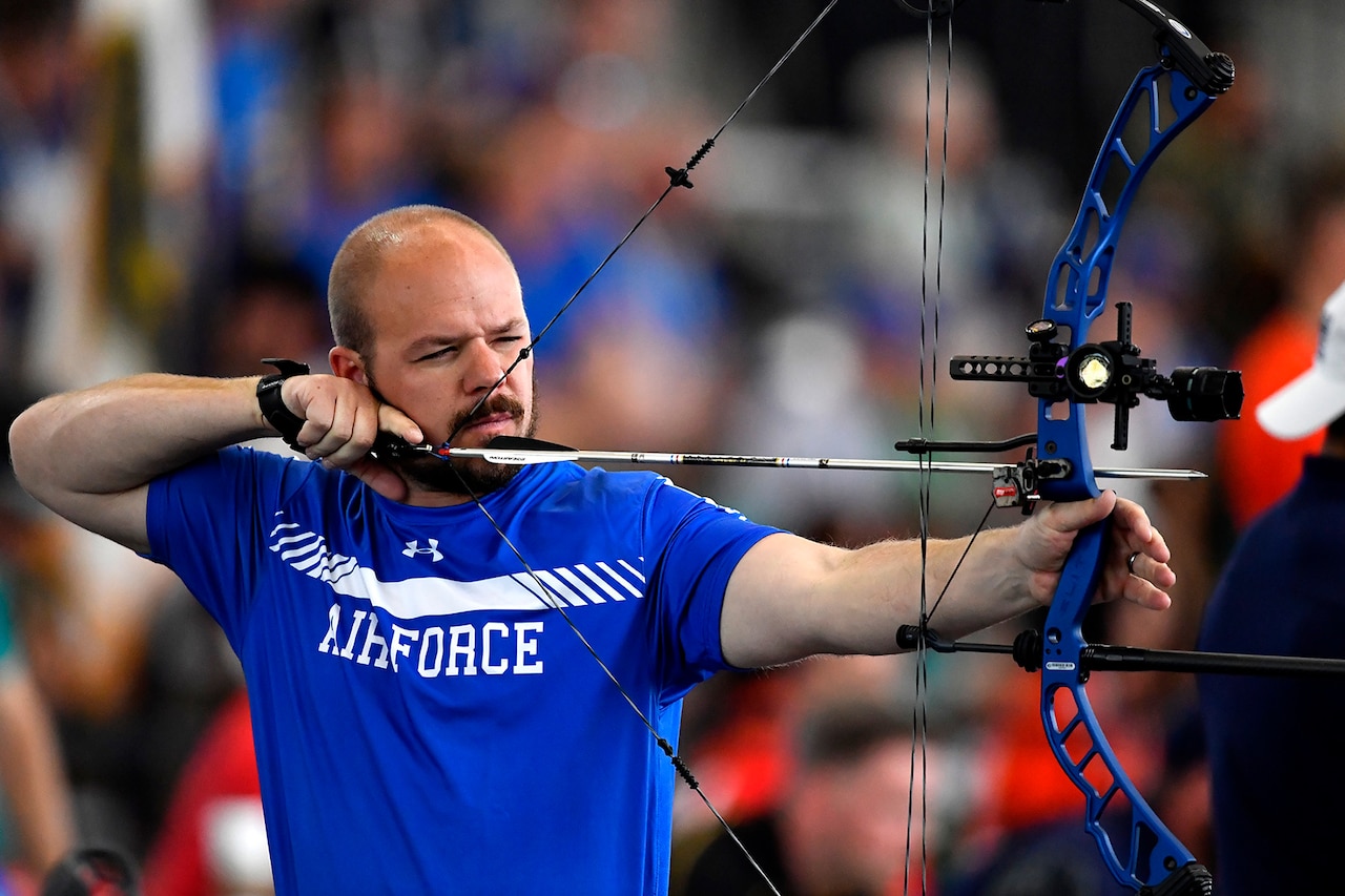 An athletes prepare to shoot an arrow