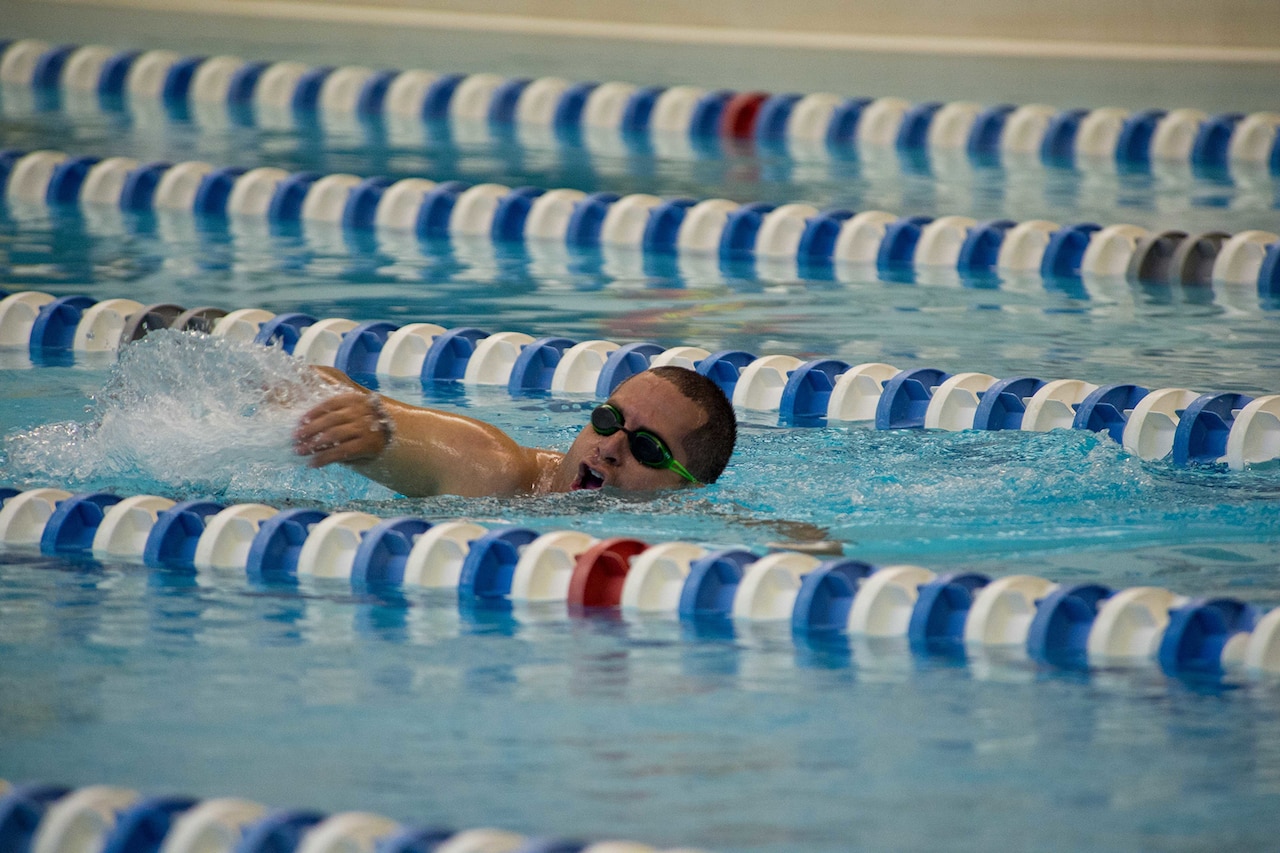 An athlete swims.