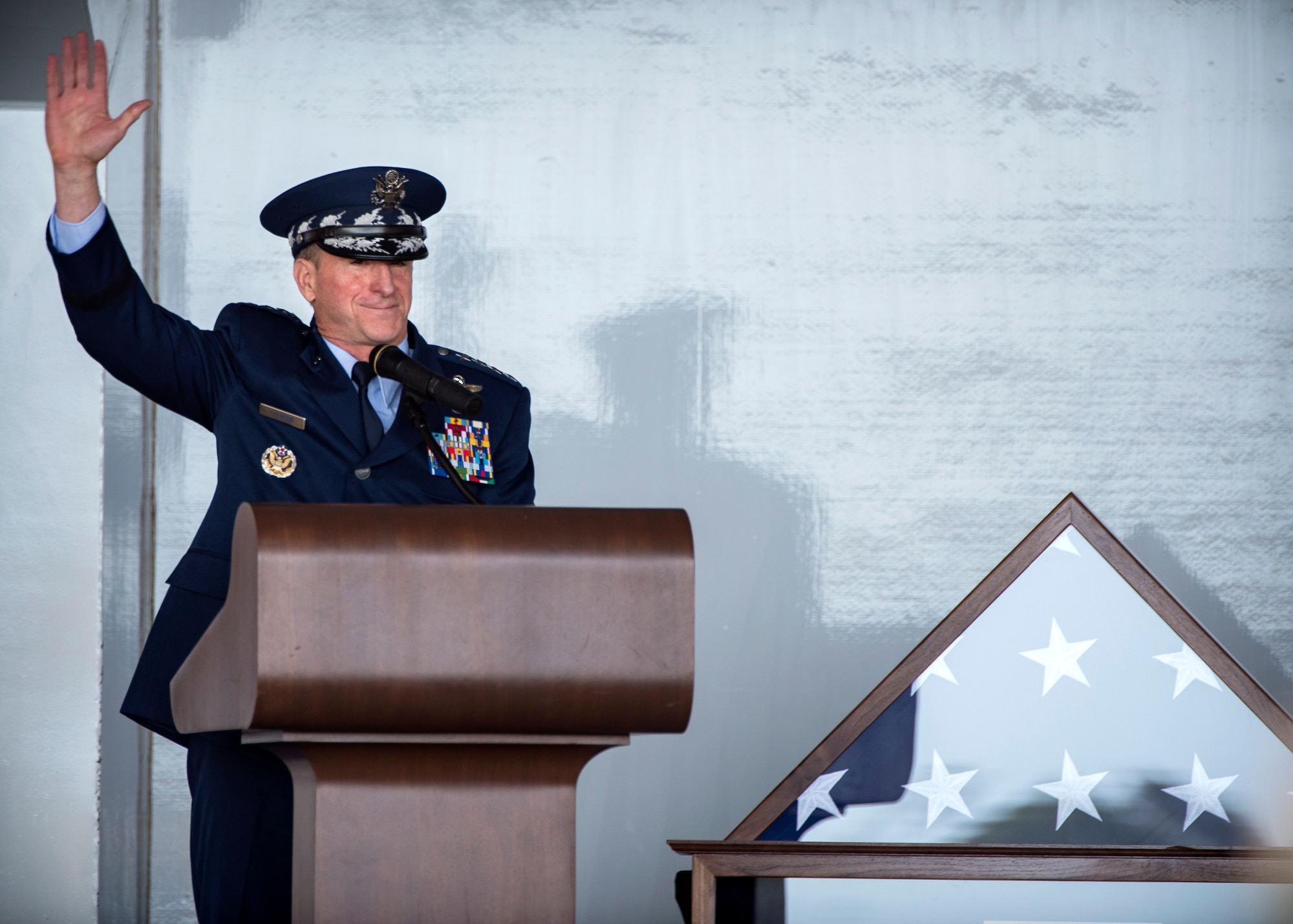 Air Force Chief of Staff Gen. David L. Goldfein, raises his hand in acknowledgement as he polls the crowd for those personally impacted by W. Parker Greene during a Celebration of Life ceremony, March 14, 2019, at Moody Air Force Base, Ga. The event was held in honor of Mr. Greene and his unwavering support to Moody, the local community and the entire Air Force for more than 40 years. Mr. Greene, a steadfast Air Force advocate and one of the most influential military civic leaders, passed away Dec. 18, 2018. (U.S. Air Force photo by Airman 1st Class Eugene Oliver)