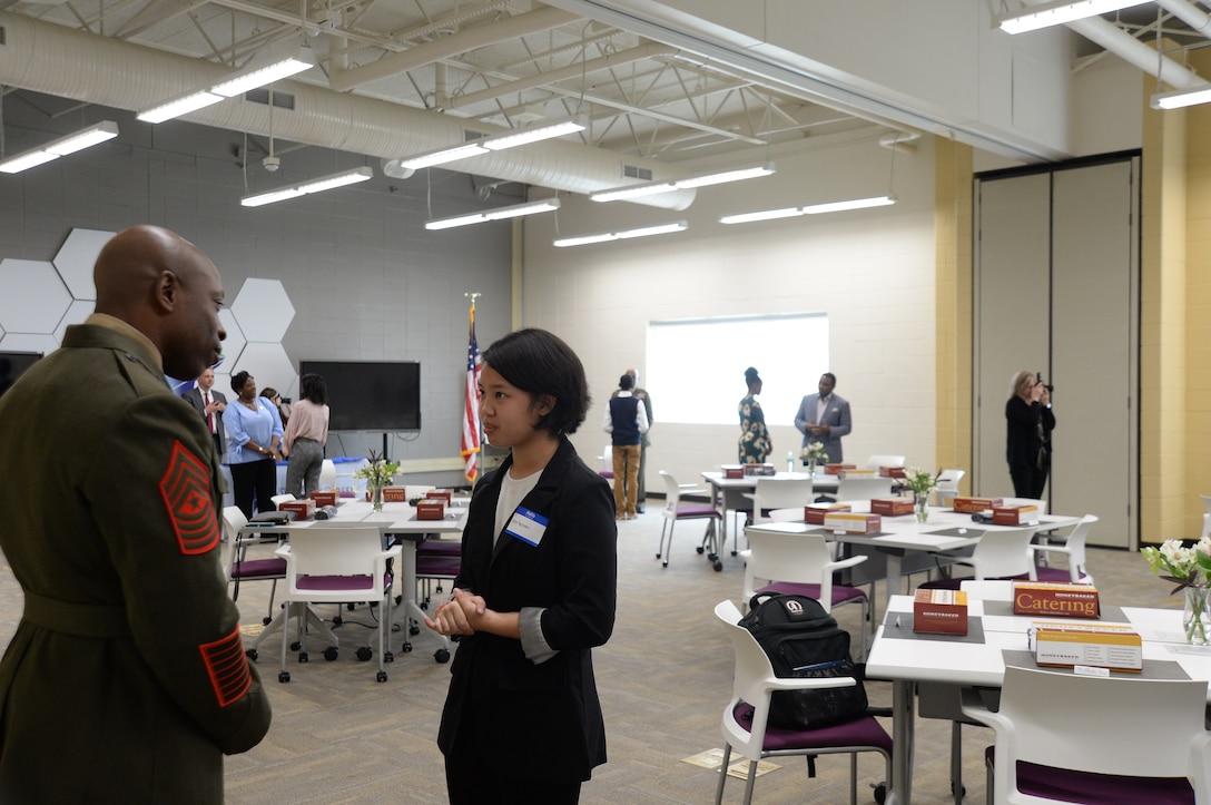 Col. Alphonso Trimble, commanding officer, and Sgt.Maj. Johnny Higdon, base sergeant major, joined other community leaders for the second annual handshake competition at the Commodore Conyers College and Career Academy, March 13.