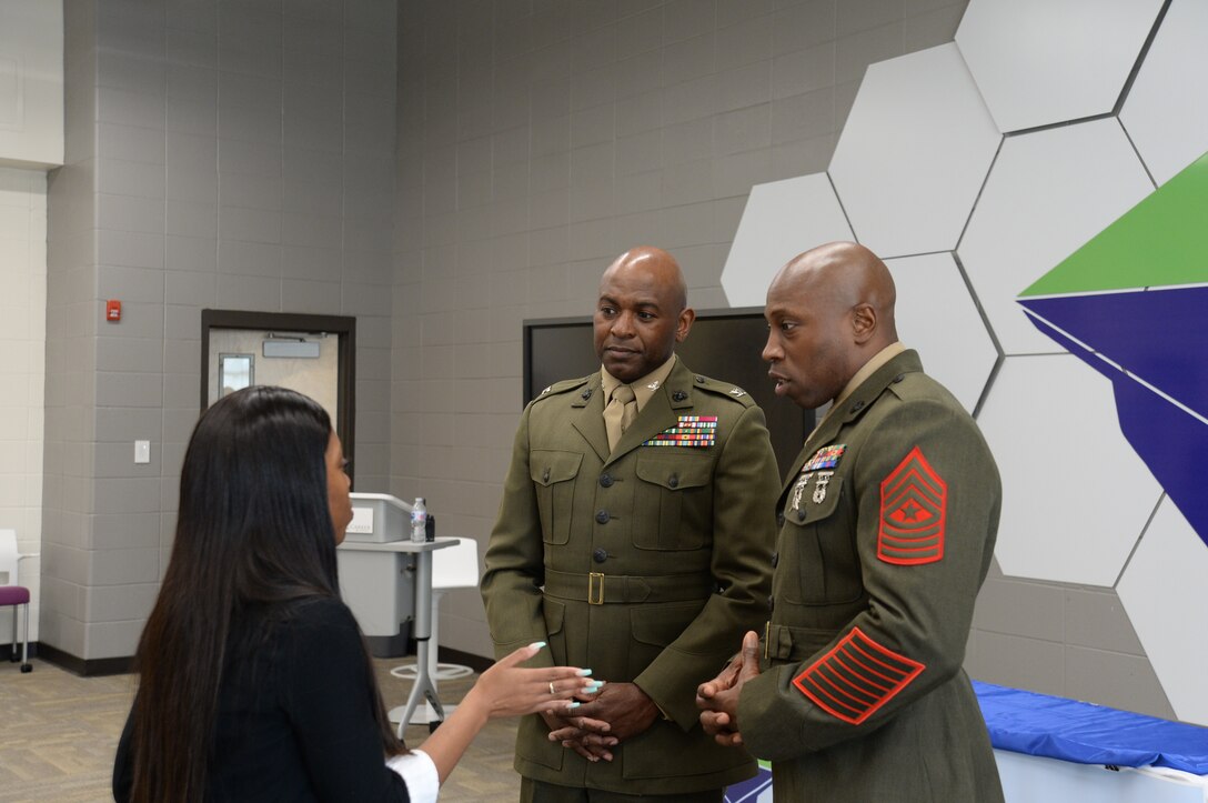 Col. Alphonso Trimble, commanding officer, and Sgt.Maj. Johnny Higdon, base sergeant major, joined other community leaders for the second annual handshake competition at the Commodore Conyers College and Career Academy, March 13.