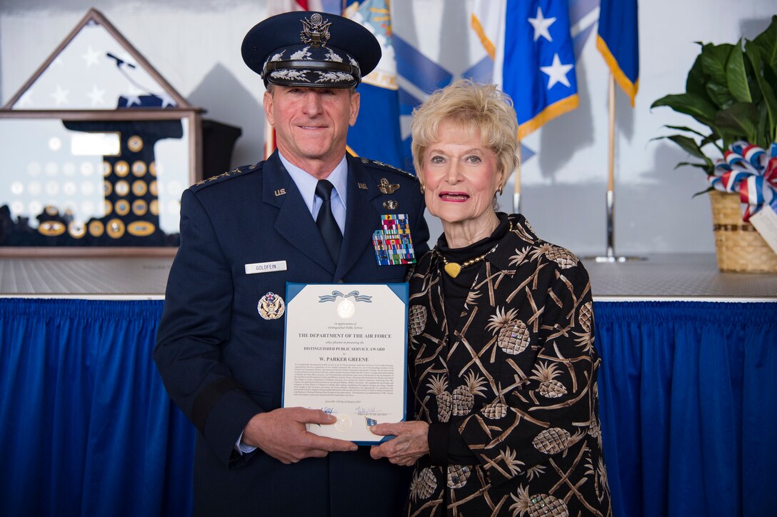 Air Force Chief of Staff Gen. David L. Goldfein presents the Air Force Distinguished Public Service Award (DPSA) to Dr. Lucy Greene, who accepted on behalf of her husband the late Mr. W. Parker Greene during a Celebration of Life ceremony, March 14, 2019, at Moody Air Force Base, Ga. Greene, a steadfast Air Force advocate and one of the most influential military civic leaders passed away Dec. 18, 2018. Greene is the first to ever receive two DPSAs, the highest honor the Air Force can bestow upon a civilian. (U.S. Air Force Photo by Andrea Jenkins)