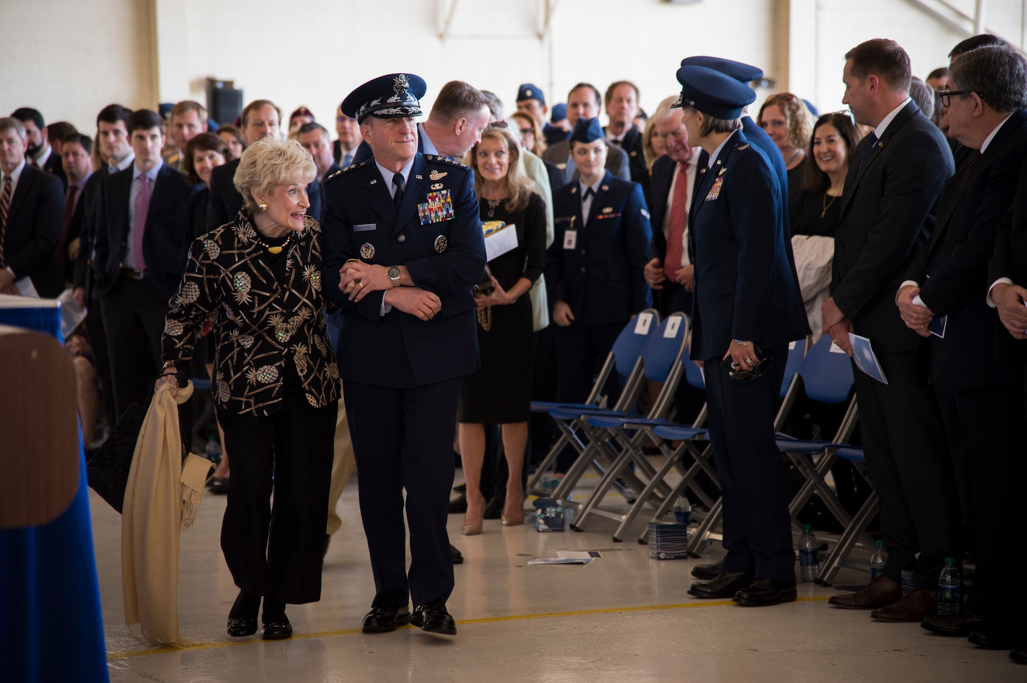 Air Force Chief of Staff Gen. David L. Goldfein escorts Dr. Lucy Greene during the Celebration of Life ceremony honoring Mr. W. Parker Greene, March 14, 2019, at Moody Air Force Base, Ga. Greene, a steadfast Air Force advocate and one of the most influential military civic leaders passed away Dec. 18, 2018. (U.S. Air Force Photo by Andrea Jenkins)