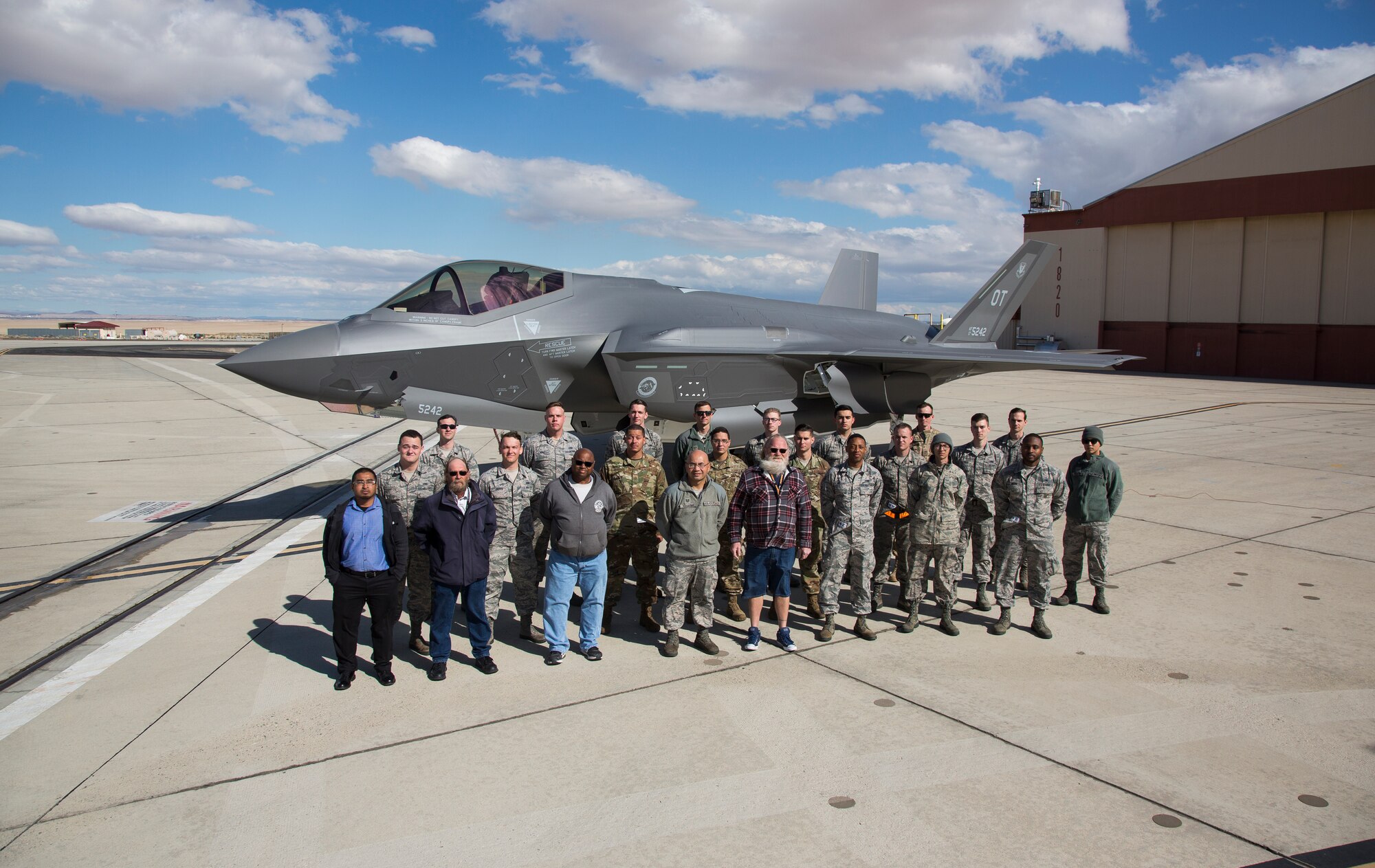 Members of the 461st Flight Test Squadron pose for a photo in front of a newly delivered F-35A March 7, 2019. (Courtesy photo by Chad Bellay/Lockheed Martin)