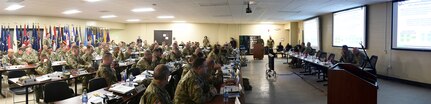 Battalion command team members and staff from the 85th U.S. Army Reserve Support Command and First Army pause for a photo with World War II Veteran, Al Mampre, during the last day of the 85th USARSC’s Battalion Commanders Huddle briefing, Mar. 10, 2019.