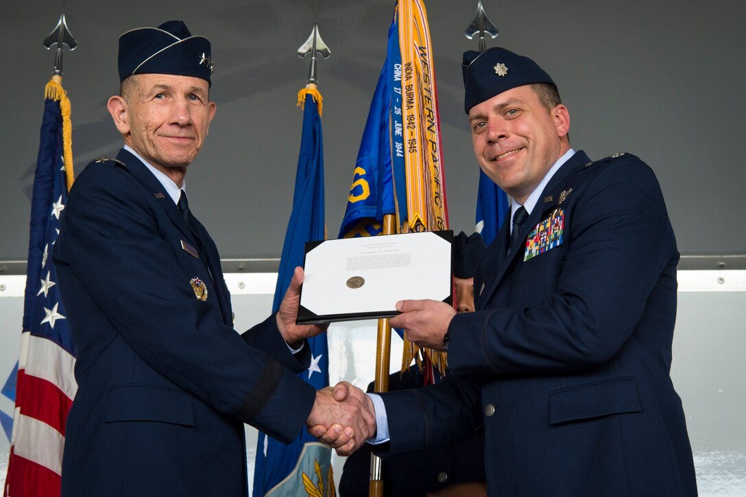 Gen. Mike Holmes, Air Combat Command commander, presents the Gallant Unit Citation to Lt. Col. Craig Morash, 74th Fighter Squadron commander, March 14, 2019, at Moody Air Force Base, Ga. When deployed, the 74th FS becomes the 74th Expeditionary Fighter Squadron (EFS), whose mission is to provide close air support, air interdiction and combat search and rescue to facilitate Operation INHERENT RESOLVE objectives. The 74th EFS distinguished itself by extraordinary heroism while engaged in conflict with an opposing force from July 15, 2017, to Jan. 15, 2018.  During this time, the 74th EFS flew over 1,600 sorties and 10,000 hours in support of the operation, striking nearly 2,500 targets and killing 3,100 Islamic State of Iraq and Syria (ISIS) fighters. Upon the 74th EFS departure, the United States declared ISIS defeated in Syria and Iraq. (U.S. Air Force photo by Airman 1st Class Taryn Butler)