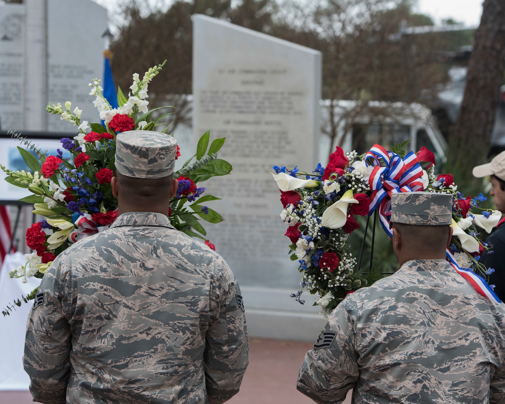 Honor guard walking with wreaths