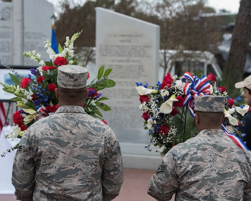 People walking up to wreath memorial in airpark