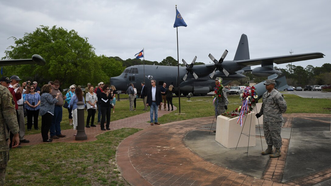 People walking up to wreath memorial in airpark