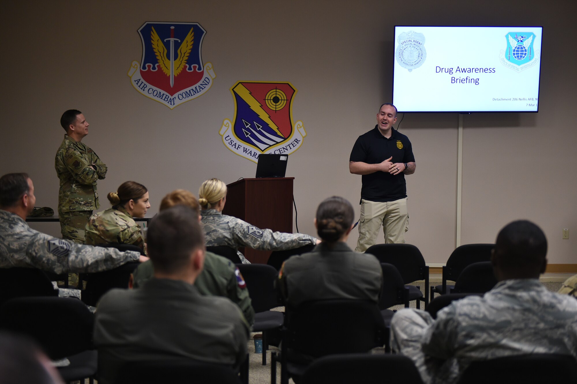 A special agent from the Nellis Air Force Base Office of Special Investigation briefs attendees at the annual anti-drug town hall and DUI awareness course at Creech Air Force Base, Nevada, March 7, 2019. The course, sponsored by the First Sergeant’s Council, consisted of briefings from 432nd Wing/432nd Air Expeditionary Wing first sergeants, OSI, and the Alcohol and Drug Abuse Prevention and Treatment office. (U.S. Air Force photo by Tech. Sgt. Dillon White)