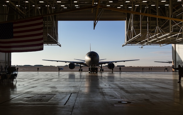 U.S. Airmen with the 22nd Aircraft Maintenance Squadron tow a new KC-46A Pegasus aircraft into Hangar 1126 at McConnell Air Force base, Kansas, Jan. 25, 2019. The KC-46 was displayed at center stage to allow guests a closer look inside the new aircraft. (U.S. Air Force photo by Airman 1st Class Alan Ricker)