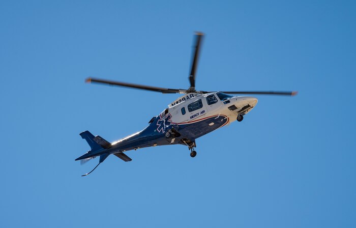 A helicopter hovers in the air.