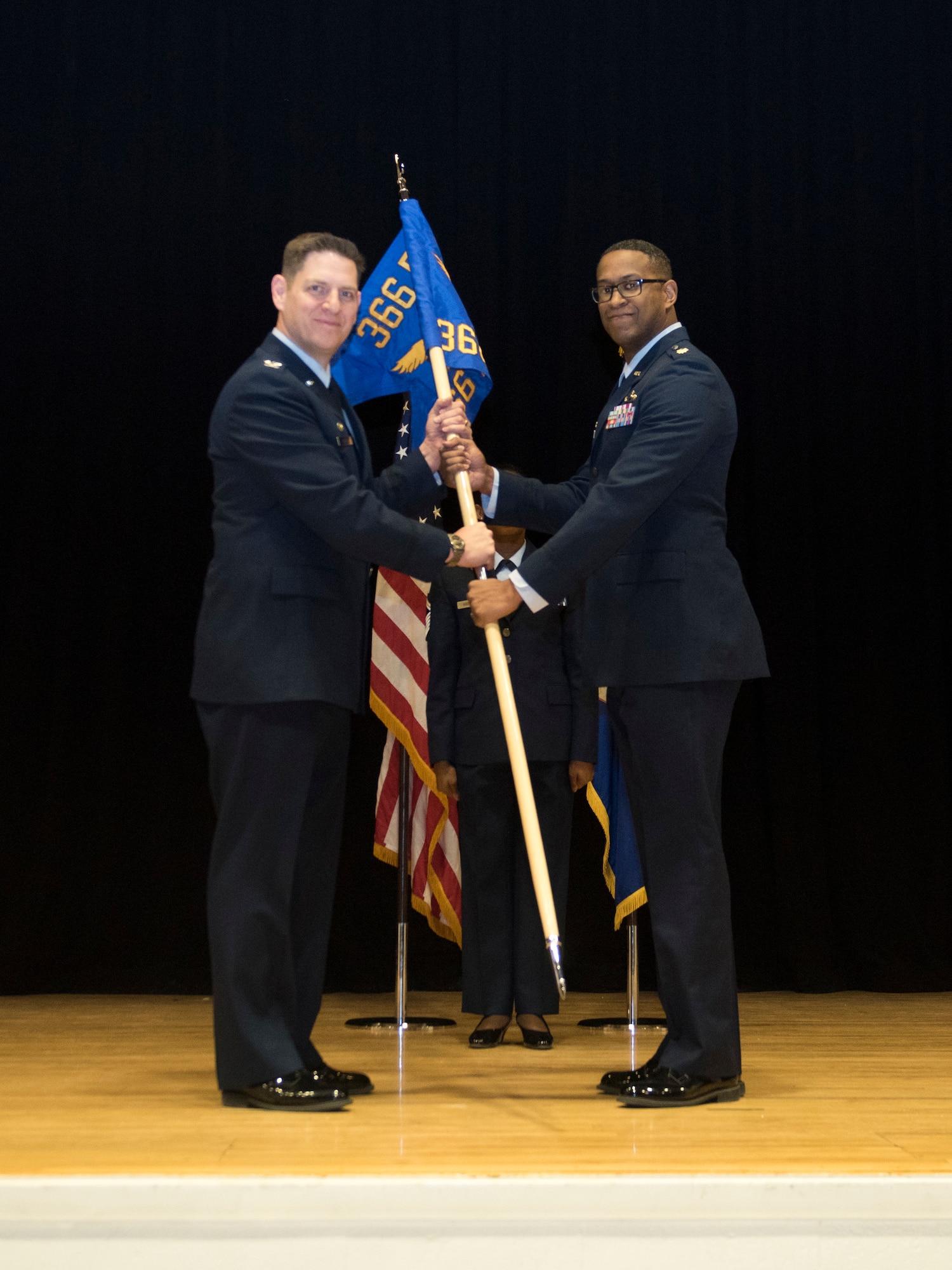 Col. Joe Kunkel, 366th Fighter Wing commander, gives Maj. Brian Williams command of the 366th Financial Acquisition Squadron March 14, 2019 at Mountain Home Air Force Base. Williams is the former 366th Contracting Squadron commander. (U.S. Air Force Photo by Airman 1st Class Hailey Bivens)