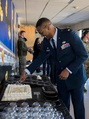 Maj. Brian Williams, 366th Financial Acquisition Squadron commander, cuts the cake after the 366th FAS activation ceremony March 14, 2019 at Mountain Home Air Force Base. Williams is the former 366th Contracting Squadron commander. (U.S. Air Force Photo by Airman 1st Class Hailey Bivens)