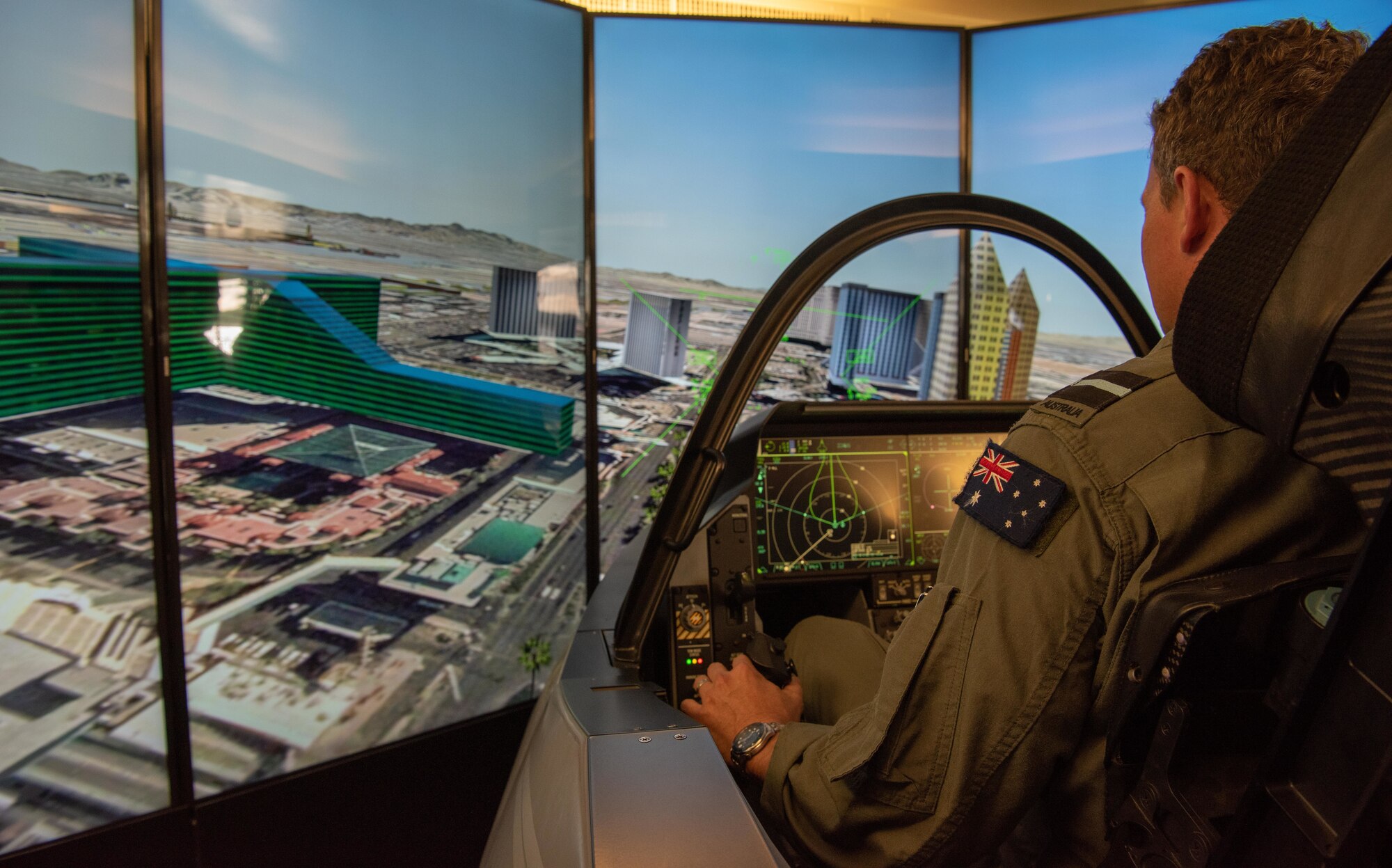 Royal Australian Air Force Air Commodore Darren Goldie, Director General Air Combat Capability, flies in an F-35 simulator during the Pacific F-35 Users Group Conference at Joint Base Pearl Harbor-Hickam, Hawaii, March 12, 2019.