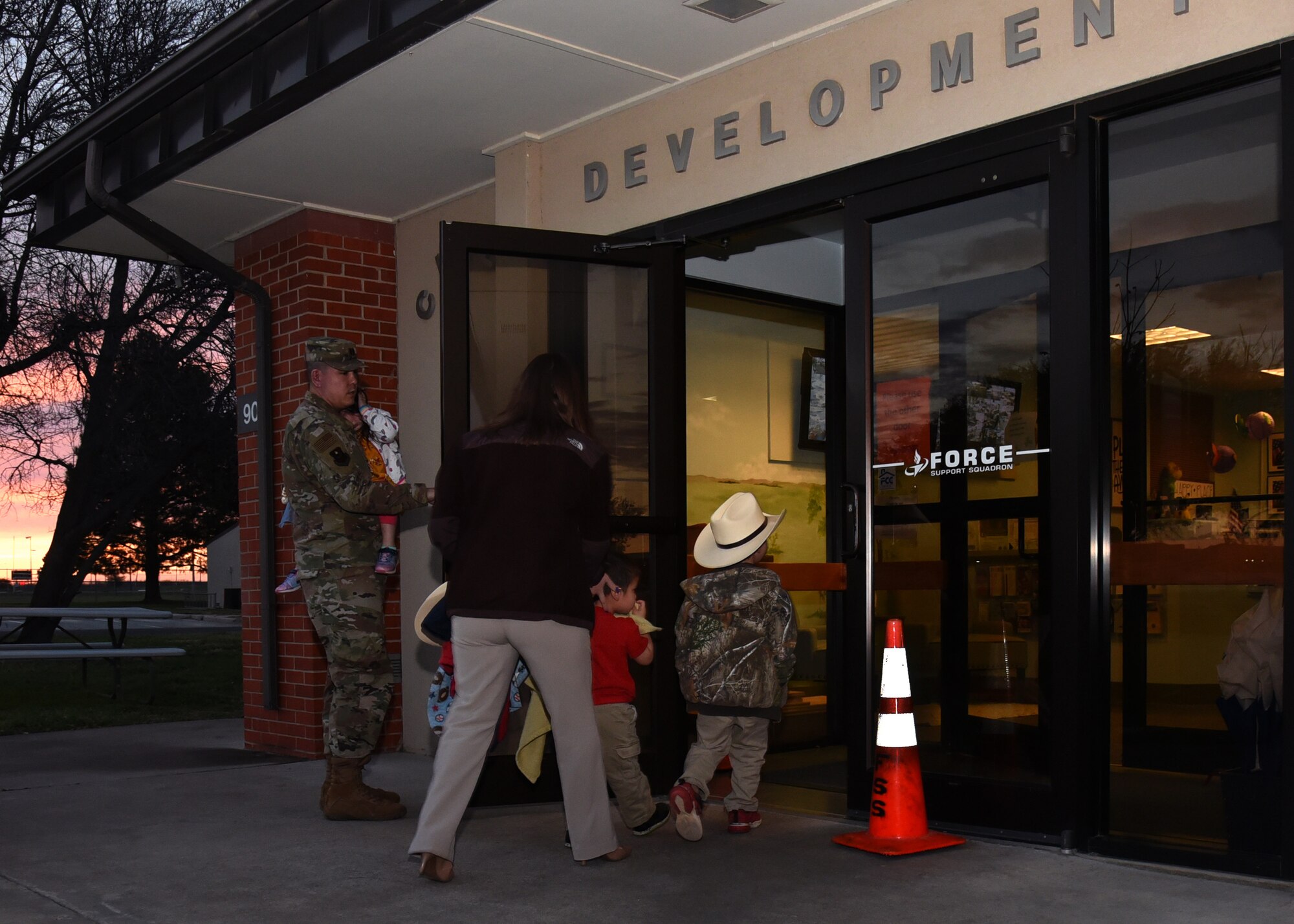 Wing Staff Agency Crossroads Coordinator, Jessica Cox walks her two children into the Child Development Center on Goodfellow Air Force Base, Texas, March 15, 2019. The CDC offers childcare services for military members, civilian employees, and government contractors. (U.S. Air Force photo by Airman 1st Class Abbey Rieves/Released)