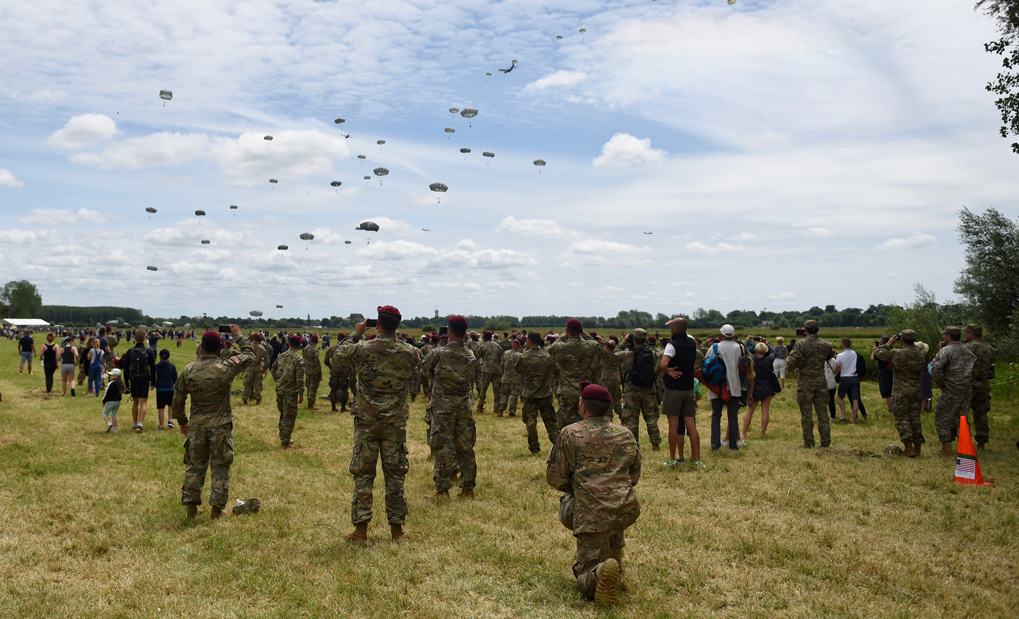 U.S. Army Paratroopers watch the airborne operation on Iron Mike II