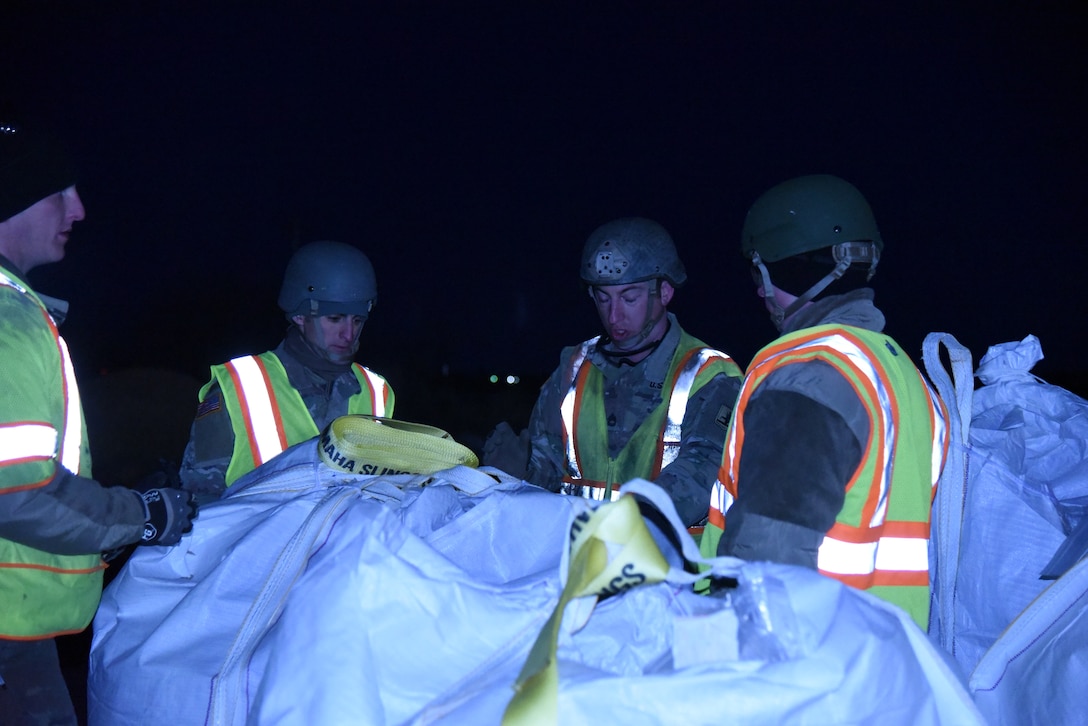 Nebraska National Guard member assemble sandbags to help with the flood.
