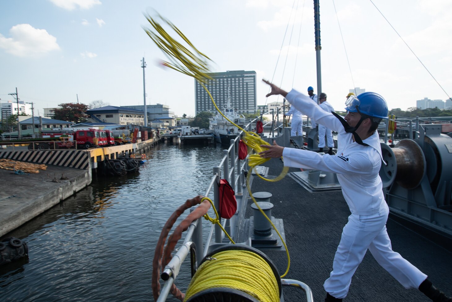 MANILA, Philippines (March 17, 2019) Mineman Seaman Logan Hardy, from Millbrook, Alabama, throws a messenger line to the pier to moor the Avenger-class mine countermeasures ship USS Chief (MCM 14) as the ship arrives in Manila, Philippines, for a port visit. Chief is visiting Manila while operating in the U.S. 7th Fleet area of operations to work with their Philippine Navy counterparts to strengthen regional security and stability, and enhance interoperability.