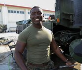 U.S. Marine Corps Lance Cpl. Martin Coggins is an electrical engineer with Engineer Maintenance Company, Combat Logistics Battalion 4, 3rd Marine Logistics Group. U.S. Marines cleaned equipment such as MTVR 7-tons, backhoes and generators for use in Australia by the Marine Rotational Force - Darwin Marine Air-Ground Task Force March 13, 2019 on Camp Kinser, Okinawa, Japan. Coggins is a native of Bronx, New York. (U.S. Marine Corps photo by Cpl. Isabella Ortega)