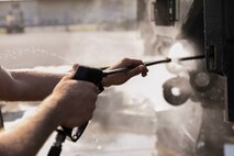 U.S. Marine Corps Pfc. Richard Baxley pressure washes a Medium Tactical Vehicle Replacement 7-Ton tow cable March 13, 2019 on Camp Kinser, Okinawa, Japan. The MTVR 7-Ton is one of many pieces of equipment that will be cleaned, inspected and then shipped for use in Australia by the Marine Rotational Force - Darwin. Baxley, a heavy equipment operator with Heavy Equipment Operations Platoon, Engineer Support Company, 9th Engineer Support Battalion, 3rd Marine Logistics Group, is a native of Lakeland, Florida. (U.S. Marine Corps photo by Cpl. Isabella Ortega)