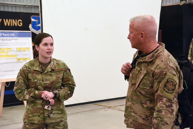 Staff Sgt. Samantha Rak, 380th Air Expeditionary Wing Host Nation Coordination Office immigrations technician, briefs an inbound member at Al Dhafra Air Base, United Arab Emirates, Mar. 5, 2019.