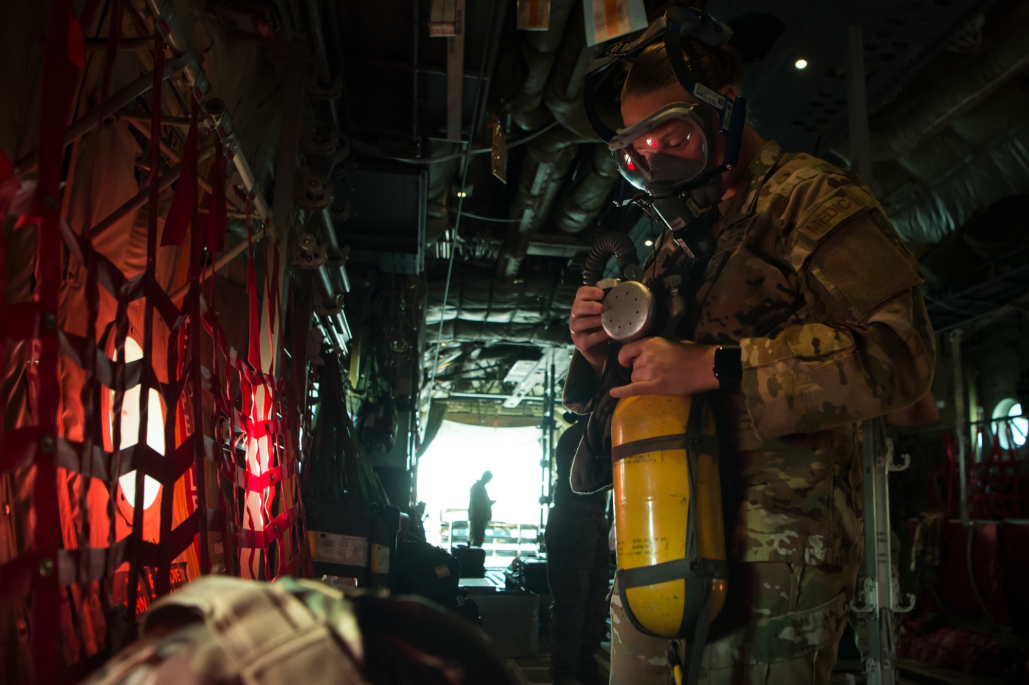 Staff Sgt. Lyndsey Glotfelty, 379th Expeditionary Aeromedical Evacuation Squadron (EAES) aeromedical evacuation technician, ensures medical equipment is operational on a C-130 Hercules at Al Udeid Air Base, Qatar, prior to a recent mission.