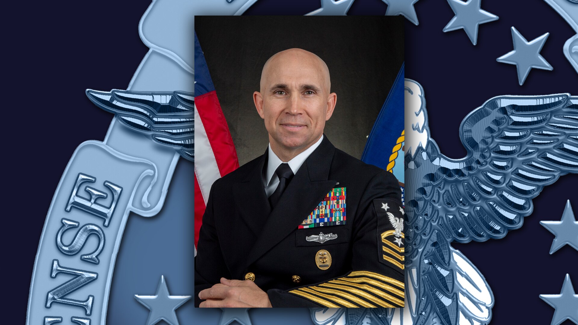 Official photo of Navy Master Chief Petty Officer James Butler against DLA rotator background.