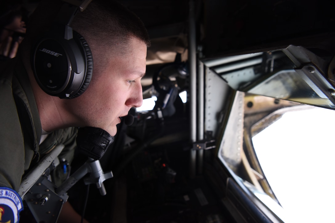 U.S. Air Force Senior Airman Corey Marion, 351st Air Refueling Squadron boom operator, performs air refueling training with Romanian air force F-16s over the skies of Romania, March 11, 2019. The training was an example of U.S. and NATO allies sharing a commitment to promote peace and stability through developing their relationship and communication process. (U.S. Air Force photo by Airman 1st Class Brandon Esau)