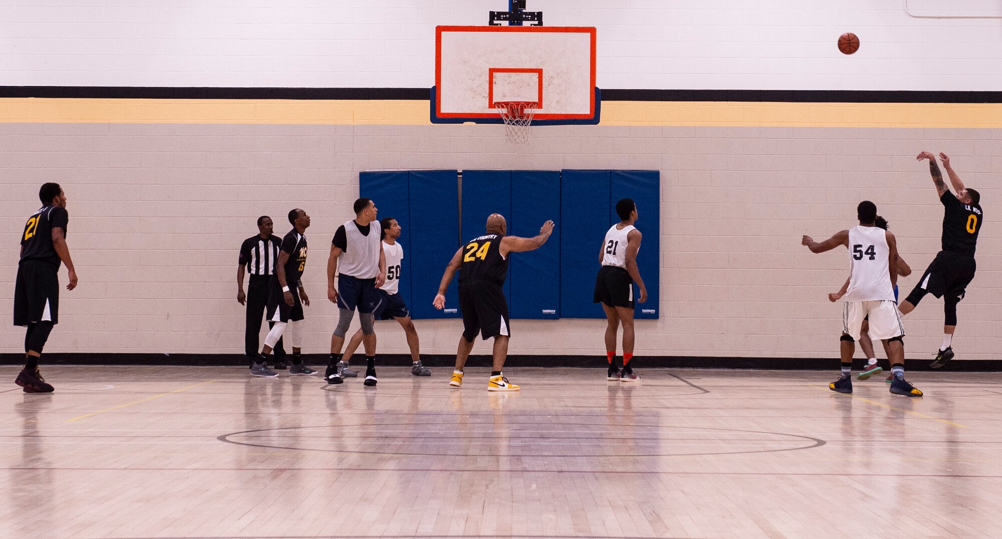 U.S. Airmen assigned to the 20th Equipment Maintenance Squadron aerospace ground equipment flight play against U.S. Soldiers assigned to U.S. Army Central Command during an intramural basketball championship game at Shaw Air Force Base, S.C., March 14, 2019.