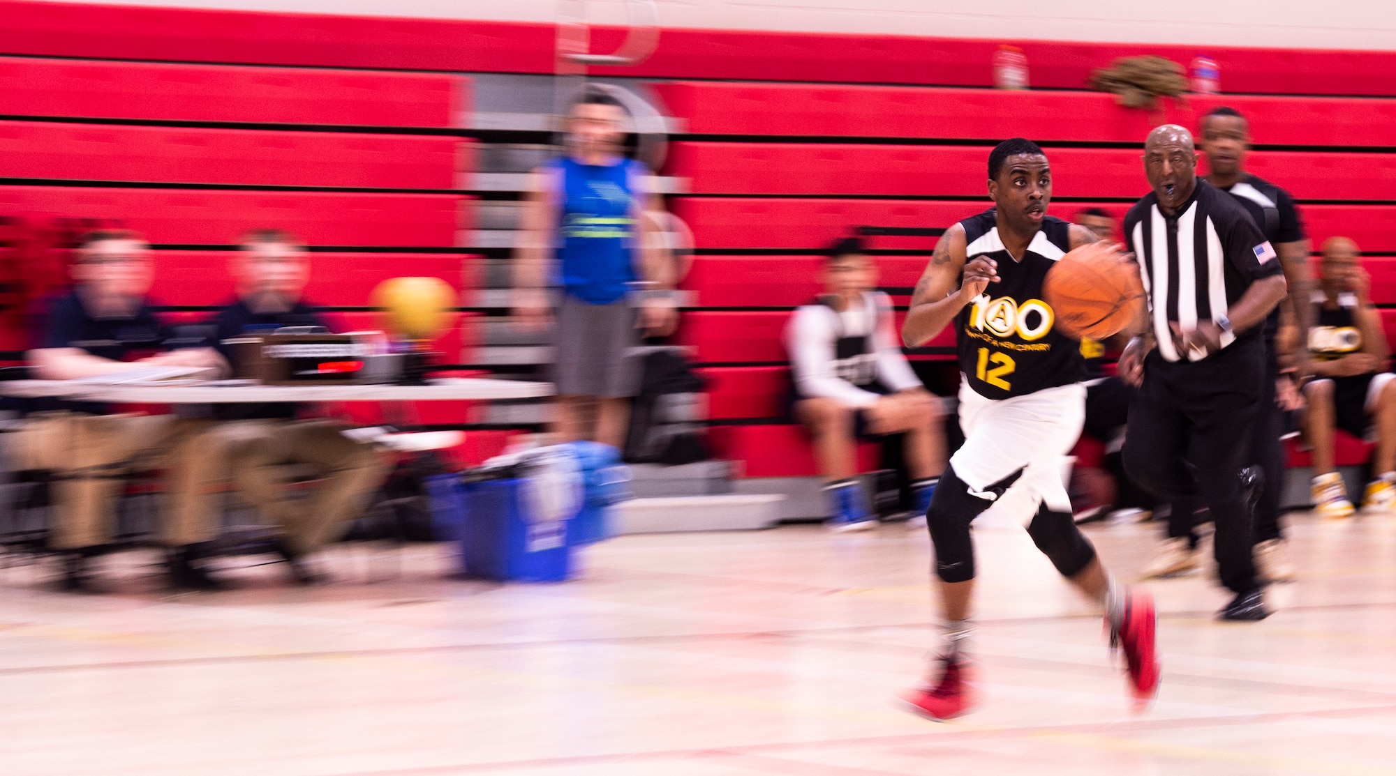 A U.S. Soldier assigned to U.S. Army Central Command (ARCENT) dribbles the ball down-court during an intramural basketball championship game at Shaw Air Force Base, S.C., March 14, 2019.