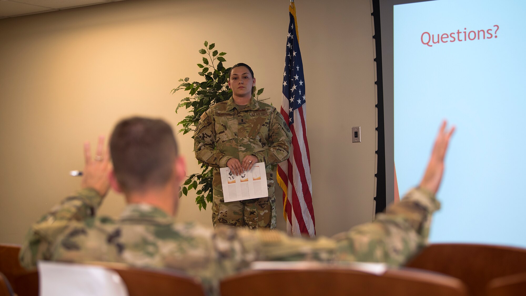U.S. Air Force Col. Stephen Snelson, 6th Air Mobility Wing commander, asks Lt. Bianca Santos, a 50th Air Refueling Squadron standardization and evaluations liaison officer, a question during the second annual Fuel Tank at MacDill Air Force Base, Fla., March 14, 2019. Santos pitched an idea to improve the KC-135 Stratotanker cockpit environment.