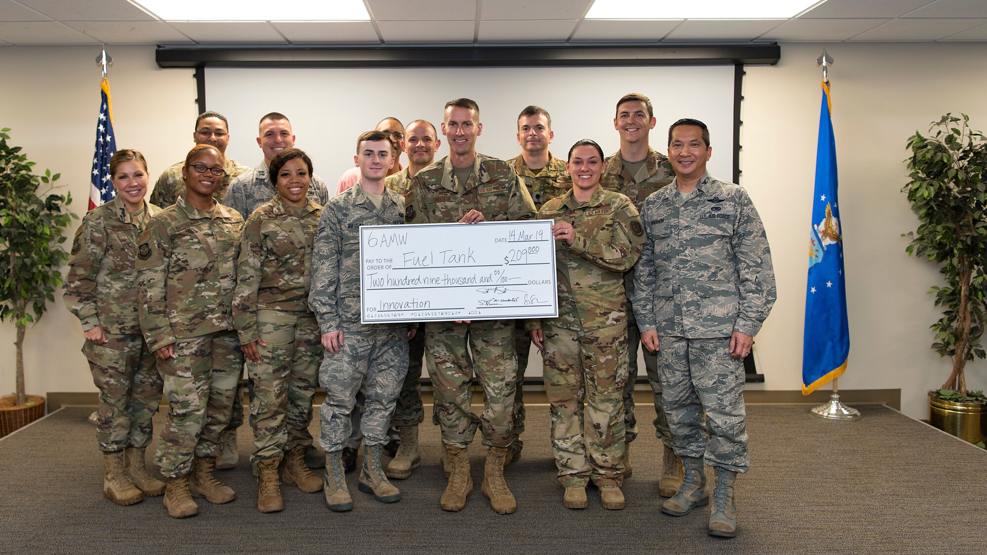 Fuel Tank presenters pause for a photo with wing leadership at MacDill Air Force Base, Fla., after being awarded $209,000 at this year’s Fuel Tank March 14, 2019. Much like Air Force’s Spark Tank, Airmen pitched their innovative ideas to improve processes, training, and equipment, and thus, effectiveness and readiness.