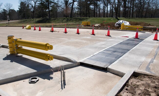 Work continues on modifications to the Main Gate at Arnold Air Force Base. "We expect to be finished with the project completely by the end of April," said Josh Cooke, utility asset manager for the Test Support Division Operations Section at the base. The active vehicle barrier foundations are in place and installation of new fencing and overwatch building was scheduled to begin the week of March 11, Cooke said. (U.S. Air Force photo by Jill Pickett)