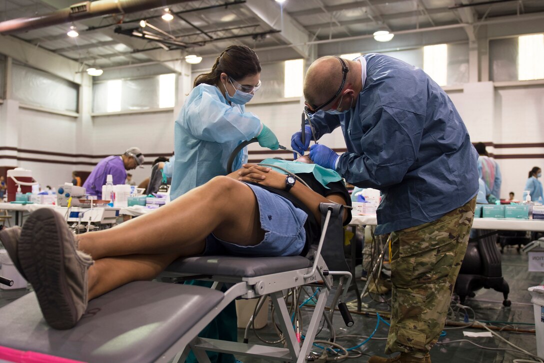 Dentist works on patient