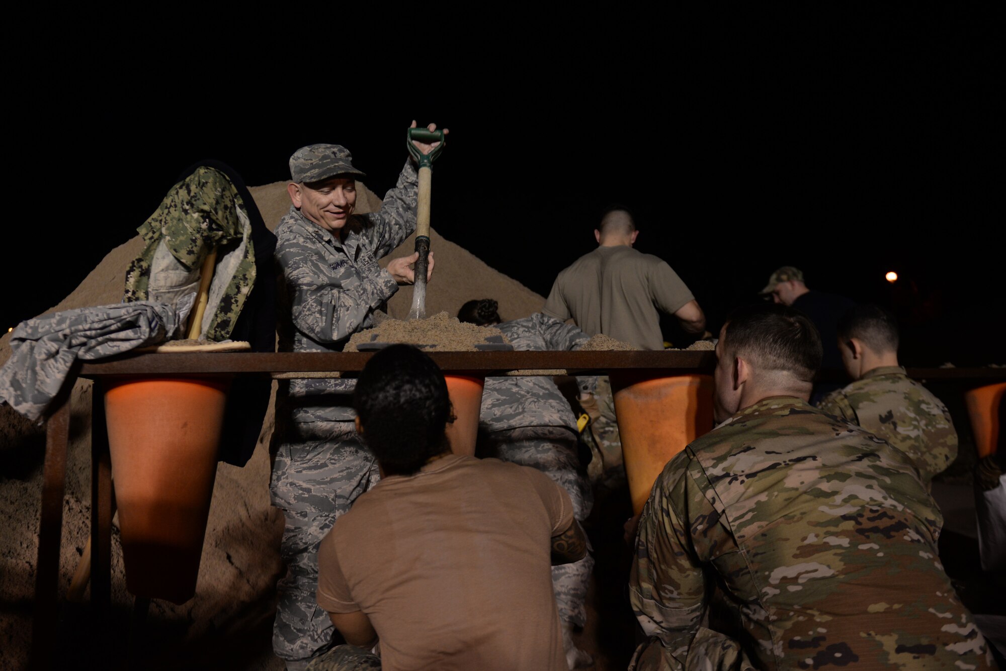 Chaplain (Maj.) Kevin Humphrey, 55th Wing chaplain, fills sandbags March 15, 2019 at Offutt Air Force Base Nebraska during preparations for anticipated flooding of the base. An increase in water levels of surrounding rivers and waterways caused by record-setting snowfall over the winter in addition to a large drop in air pressure caused widespread flooding across the state of Nebraska. (U.S. Air Force photo by TSgt. Rachelle Blake)