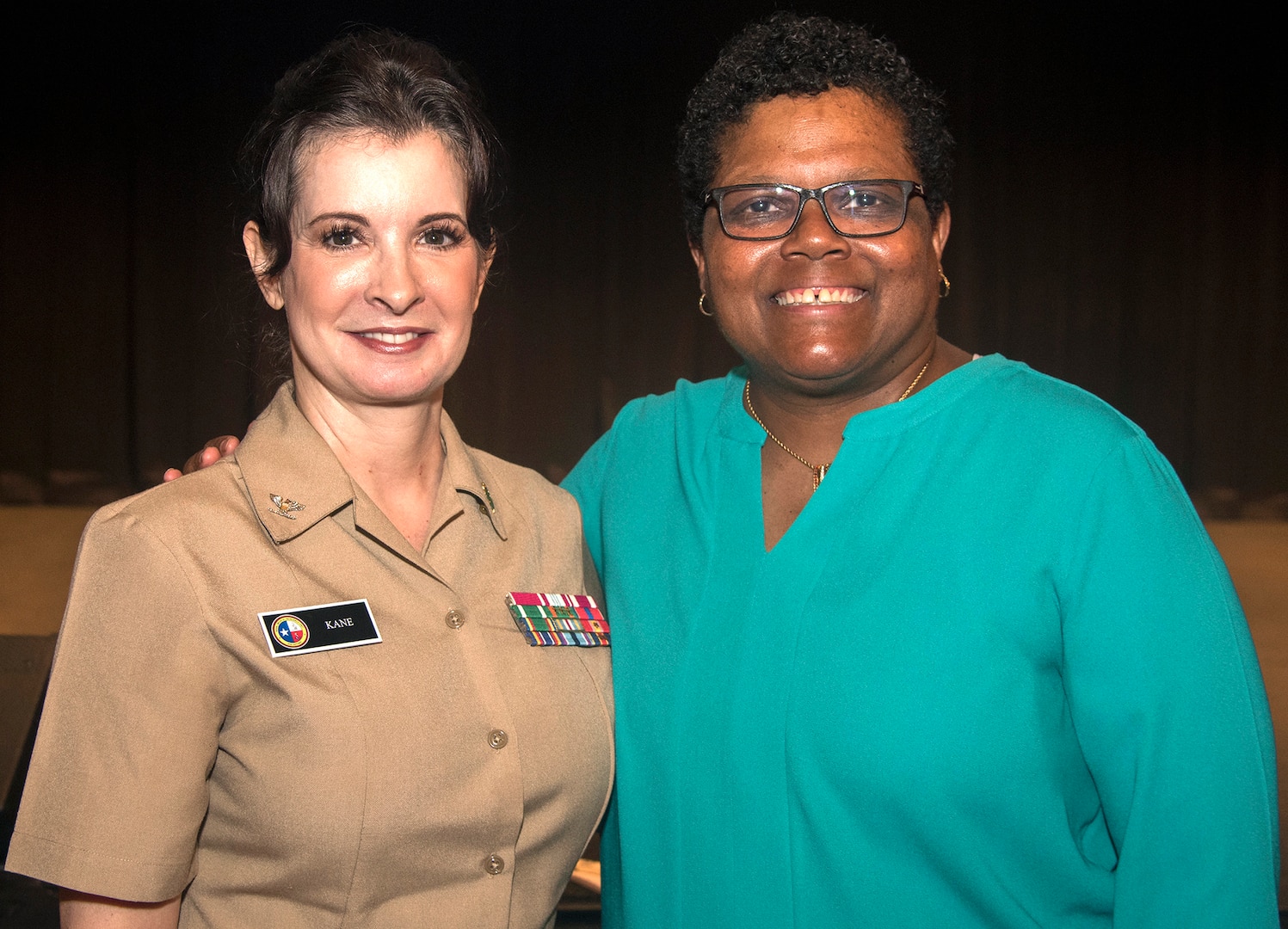 Navy Capt. Michele A. Kane, executive officer, Naval Medical Research Unit San Antonio, poses for a photo with retired Command Master Chief Octavia Harris during the Joint Base San Antonio-Fort Sam Houston Women’s History Month observance March 13.