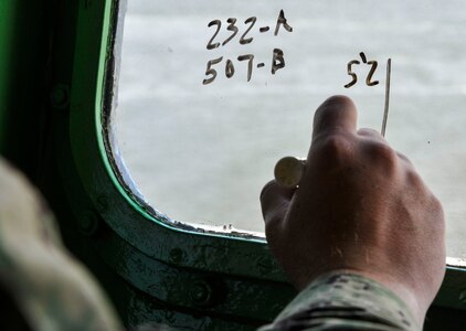 Master-at-Arms Chief Petty Officer Mark Puckett, Coastal Riverine Squadron 10 Bravo 2nd Platoon, takes note of boat movements during battle drills March 12, 2019, at Joint Base Charleston, S.C. – Naval Weapons Station.
