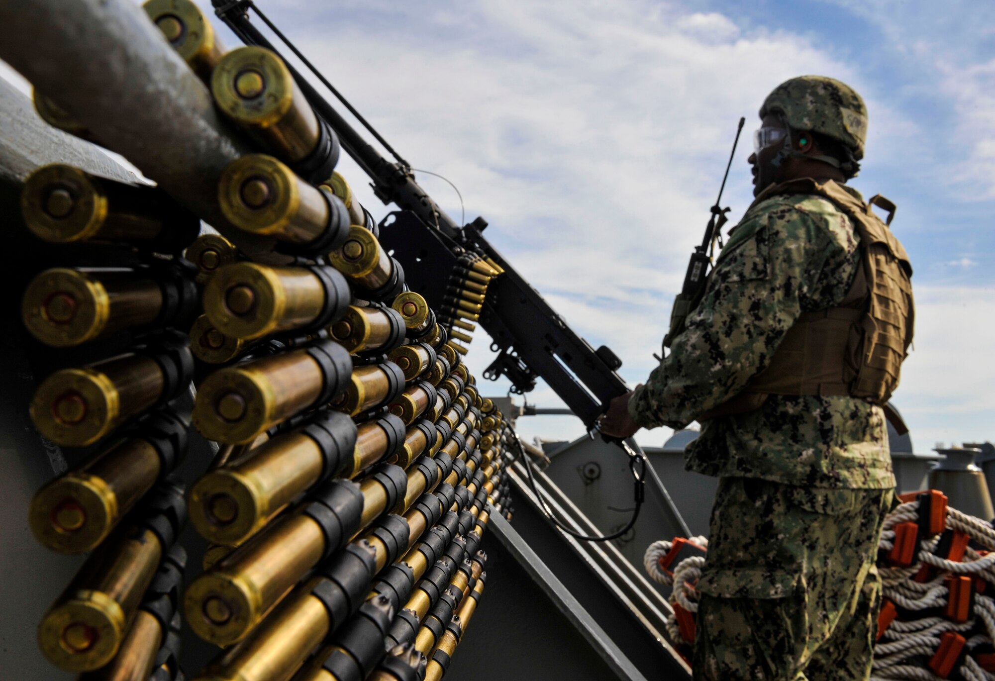 Yeoman 2nd Class Gerard Mercadel, Coastal Riverine Squadron 10 Bravo 2nd Platoon, prepares to fire a 50 caliber machine gun outfitted with blank fire adapters March 14, 2019, at Joint Base Charleston, S.C. – Naval Weapons Station.