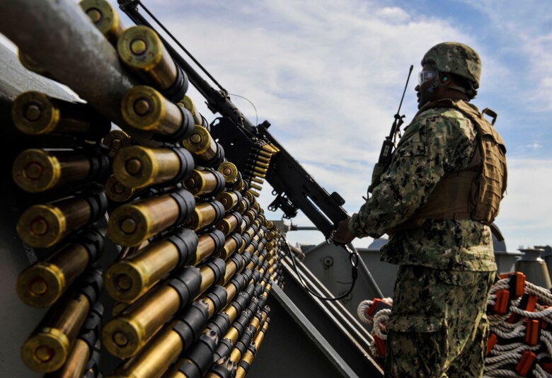 Yeoman 2nd Class Gerard Mercadel, Coastal Riverine Squadron 10 Bravo 2nd Platoon, prepares to fire a 50 caliber machine gun outfitted with blank fire adapters March 14, 2019, at Joint Base Charleston, S.C. – Naval Weapons Station.