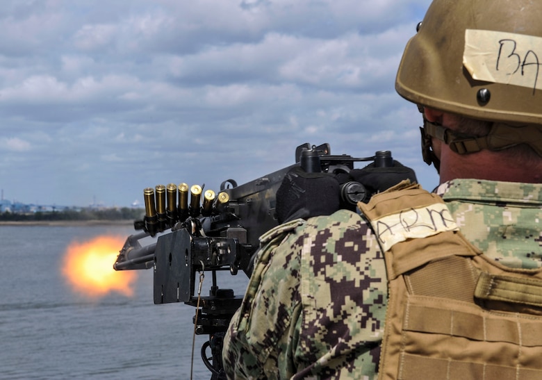 Master-at-Arms Petty Officer 3rd Class Adam Bolas, Coastal Riverine Squadron 10 Bravo 2nd Platoon, fires a 50 caliber machine gun outfitted with blank fire adapters March 14, 2019, at Joint Base Charleston, S.C. – Naval Weapons Station.