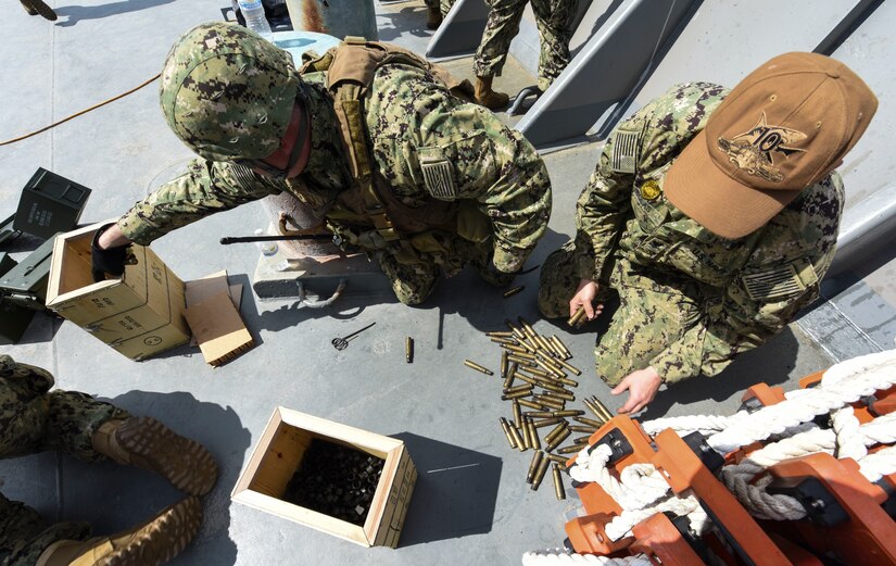 Sailors from the Coastal Riverine Squadron 10 Bravo clean up after an exercise March 14, 2019, at Joint Base Charleston, S.C. – Naval Weapons Station.