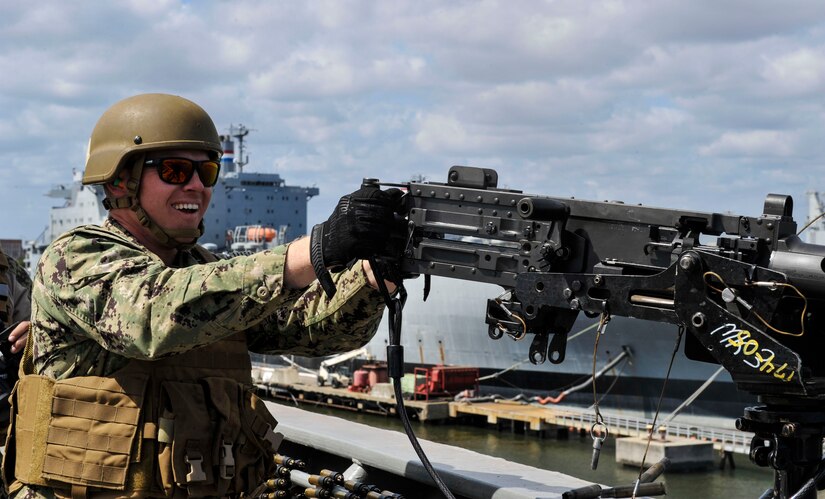Master-at-Arms Petty Officer 3rd Class Adam Bolas, Coastal Riverine Squadron 10 Bravo 2nd Platoon, fires a 50 caliber machine gun outfitted with blank fire adapters March 14, 2019, at Joint Base Charleston, S.C. – Naval Weapons Station.