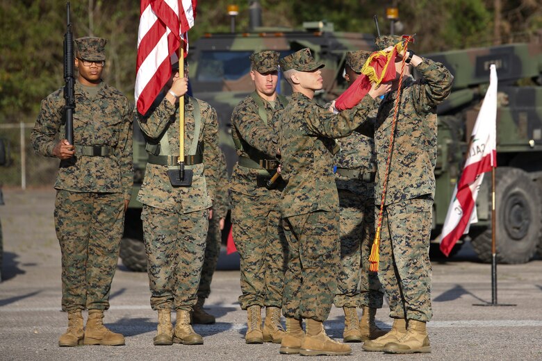 Capt. Kevin Buonomo and 1st Sgt. Adrian Munoz handle the company guidon during Combat Logistics Company 23's realignment ceremony aboard Marine Corps Air Station Beaufort, March 15. Buonomo is the Company Commander and Munoz is the Company 1st Sgt. of CLC-23.