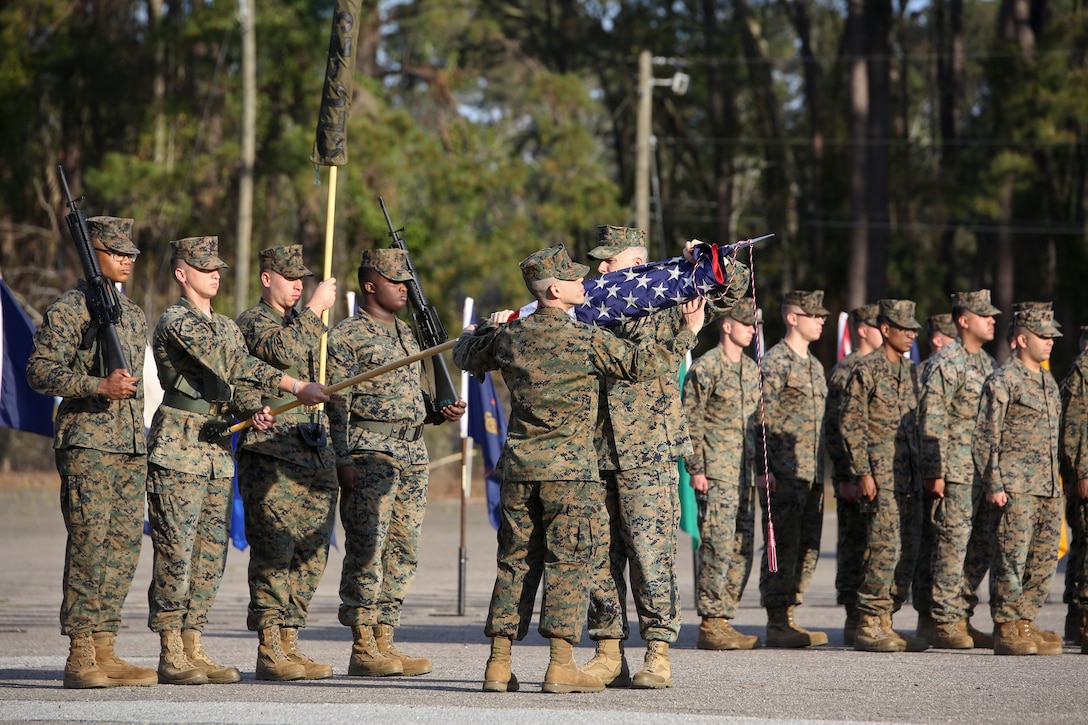 Capt. Kevin Buonomo and 1st Sgt. Adrian Munoz handle the national colors during Combat Logistic Company 23's realignment ceremony aboard Marine Corps Air Station Beaufort, March 15. Buonomo is the Company Commander and Munoz is the Company 1st Sgt. of CLC-23.