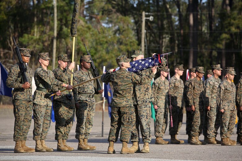 Capt. Kevin Buonomo and 1st Sgt. Adrian Munoz handle the national colors during Combat Logistic Company 23's realignment ceremony aboard Marine Corps Air Station Beaufort, March 15. Buonomo is the Company Commander and Munoz is the Company 1st Sgt. of CLC-23.