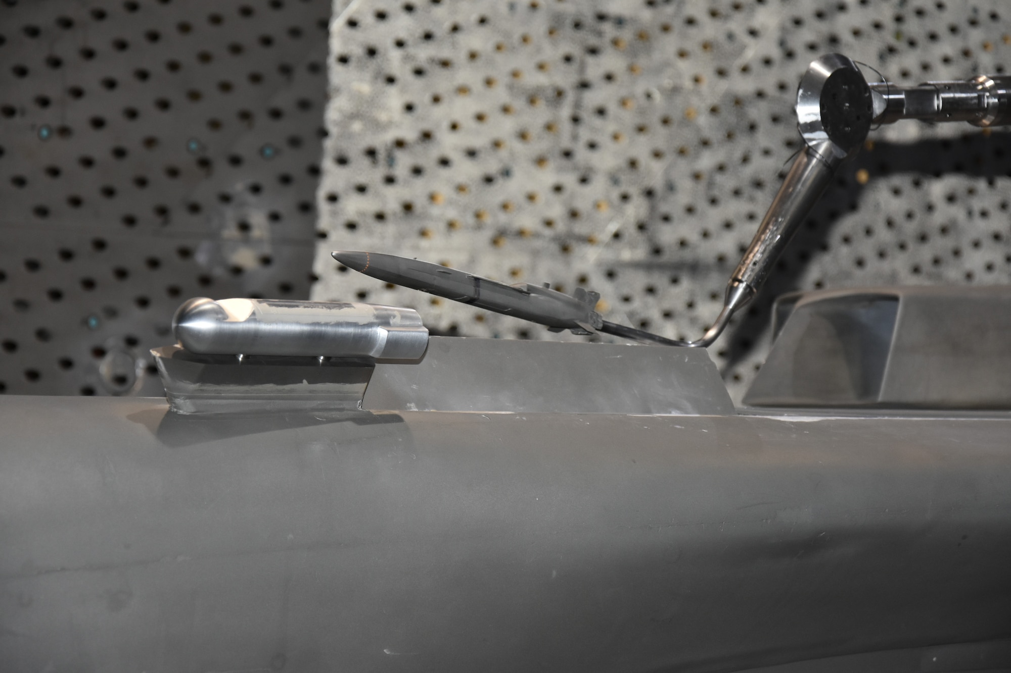 A store model positions near one of the three weapons bays on a 10 percent model of the B-1B Lancer. For the first time since 2000, the B-1B is involved in testing at Arnold Air Force Base. Tests are currently ongoing to determine the effects a newly-introduced targeting pod for the B-1B would have on stores released from the aircraft. (U.S. Air Force photo by Bradley Hicks)