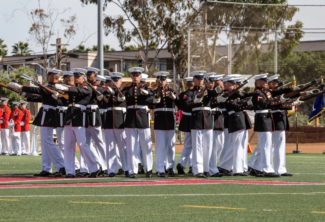 The U.S. Marine Corps Silent Drill Platoon, Battle Color Detachment, Marine Barracks Washington, D.C., performs in front of Marine Corps Air Station Miramar’s leaders, family and friends during the 2019 Battle Color Ceremony at MCAS Miramar, Calif., Mar. 15. The ceremony is held to honor Marine Corps traditions through performances by  “The Commandants Own”, the Silent Drill Platoon and the Battle Colors Detachment as a whole. (U.S. Marine Corps photo by Cpl. Becky Cleveland)